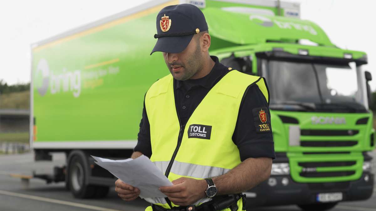 A customs officer checking papers